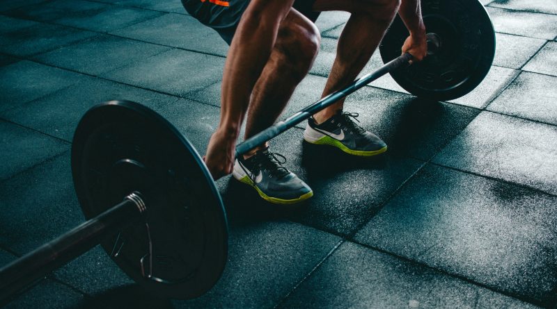 People working out in a gym illustrating common unspoken gym etiquette rules