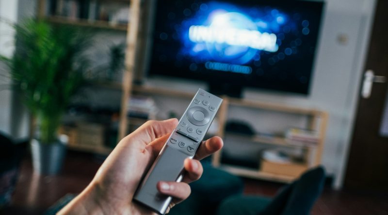 person browsing streaming platforms looking for underrated tv series