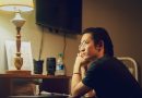 Professional reflecting on changing careers after 30 while working late at a desk