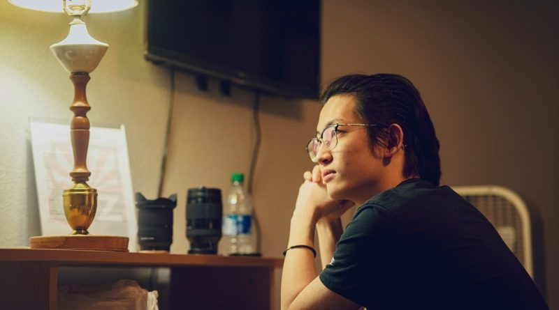 Professional reflecting on changing careers after 30 while working late at a desk